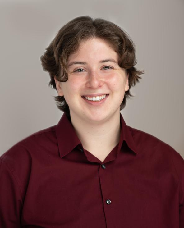 Kieran Shanahan headshot - wearing a burgundy button down