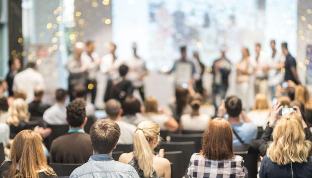 People applauding award winners